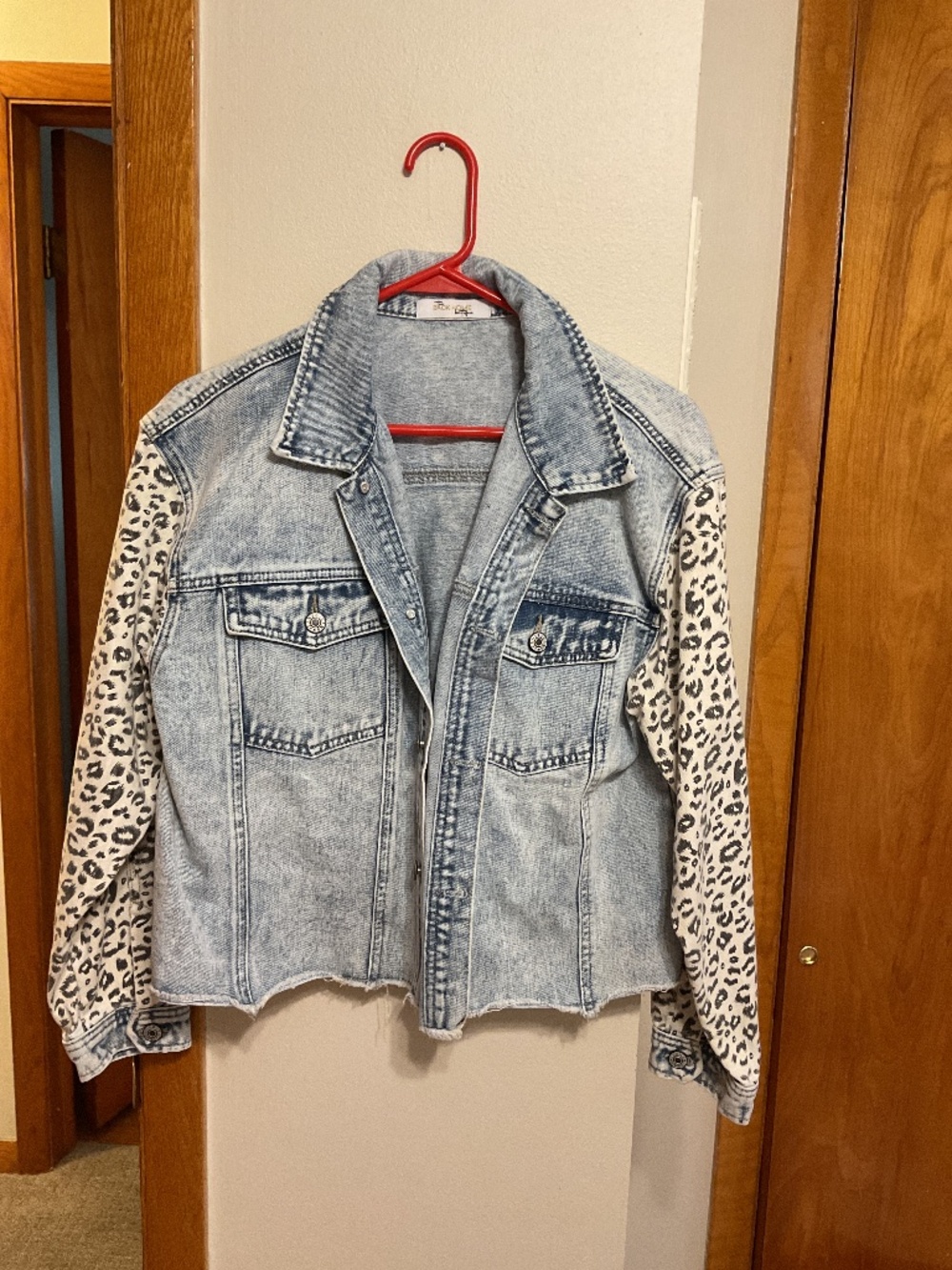 Jean jacket with leopard print arms and under collar